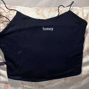 Black crop top that says “honey”. Super cute ;)